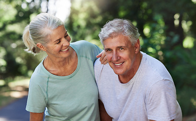 Image showing Senior couple, exercise and happy outdoor for a run, workout and training on road for fitness. Elderly man and woman laugh and tired together for cardio health and wellness while running in nature