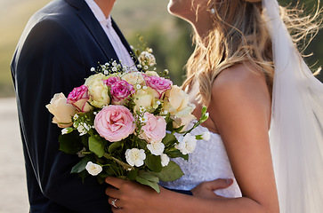 Image showing Flower bouquet, marriage hug and wedding ceremony couple for unity commitment, romantic trust or union event. Bridal flowers, love and body embrace of groom, bride or fiance in solidarity and support