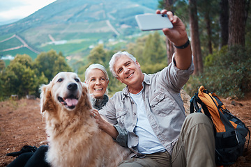 Image showing Couple, hiking and dog selfie outdoor in nature for exercise, fitness and trekking for health and wellness. Happy senior man and woman with pet animal on hike in forest for workout, cardio and memory