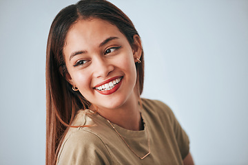 Image showing Woman, smile and happiness of a gen z female in a studio with gray background. Isolated, happy and beauty from a young person feeling carefree, relax youth and confidence with female empowerment