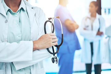 Image showing Hands, stethoscope and doctor with arms crossed for cardiology in hospital or clinic. Healthcare, cardiologist or medical professional or confident woman with equipment for heart health or wellness.