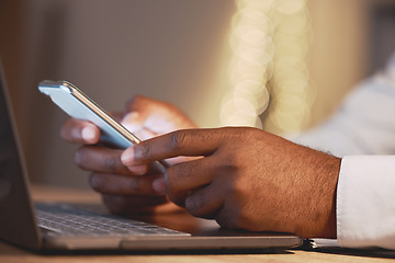 Image showing Business man, hands and phone by a laptop typing a message for work networking. Hand closeup, bokeh and online management of a employee working and planning a job schedule with technology and email