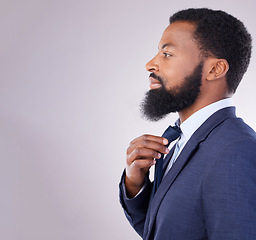 Image showing Black businessman tie dressing and studio background with business mindset isolated in mockup space. Success, pride and profile of confident African man in suit, successful leader in corporate Africa