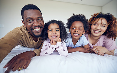 Image showing Selfie, portrait and black family relax in bed, smile and cheerful in their home together. Face, photo and children resting indoors with parents, happy and posing for profile picture and memory