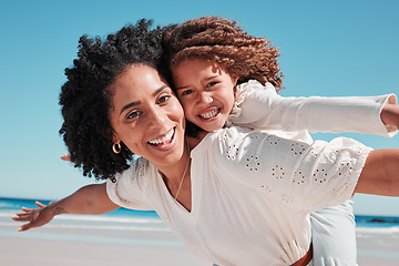 Image showing Portrait, mother and girl at a beach for airplane, game and bonding, happy and excited for travel, playing or family summer on blue sky. Face, piggyback and mom with child at a sea in Mexico