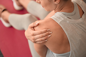 Image showing Shoulder injury, woman and pain in gym from exercise, medical emergency and injured muscle, problem and above. Closeup female, arm and sports accident from workout, first aid and fitness health risk