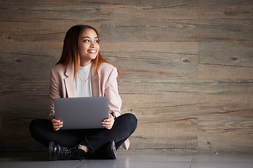 Image showing Woman, thinking and laptop with space for idea for advertising or product placement mockup. Smile of female on wooden background for internet connection for search, inspiration or student scholarship