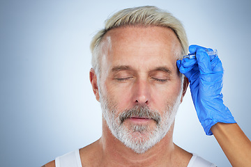 Image showing Needle, face and cosmetic of a senior man in a studio doing plastic surgery and cosmetic skincare. Dermatology, wrinkles and anti aging treatment of a mature model with silicone filler injection