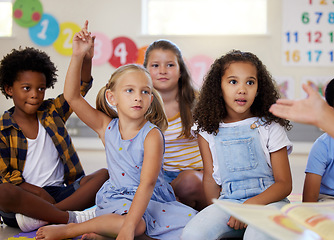 Image showing Teacher, hands up or kids in classroom learning, test or studying with preschool story books. Development or smart children or young students with answers, ideas or knowledge in kindergarten creche