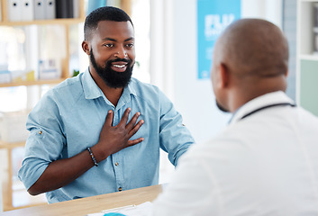 Image showing Doctor, patient and consulting in healthcare checkup, illness or appointment at the hospital. Black man talking to medical professional about chest pain, consultation or health problems at clinic