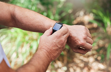 Image showing Time, notification and hands with a watch for fitness, running and cardio progress in nature. Sports, health and arms of a runner checking pulse, heart rate and training results on a wristwatch