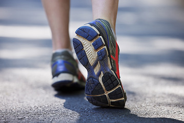 Image showing Feet, fitness and person in the road for walking, exercise and training. Active, sports and closeup of the shoes of a runner or athlete in the street to start running, jogging or cardio workout