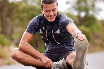 Image showing Fitness, man and stretching legs for workout, exercise or training in the nature outdoors. Happy, fit and active male smile in warm up leg stretch to start sport, run or exercising on street or road