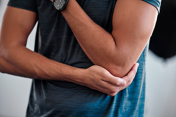 Image showing Elbow injury, fitness and man in pain, first aid emergency and health risk of training, accident or wound fracture. Closeup male sports athlete, arm problem and inflammation of body joint in exercise