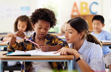 Image showing Teacher, learning and helping black kid in classroom for knowledge, studying or assessment. Teaching, development and boy or student with woman for education answer in notebook in kindergarten.