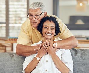 Image showing Portrait, relax and senior happy couple hug, care and enjoy quality time together on home living room sofa. Retirement happiness, marriage love bond and romantic elderly husband, wife or people smile