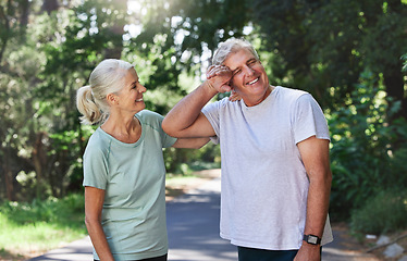 Image showing Senior couple, exercise and laugh outdoor for run, workout and training on road for fitness. Old man and woman happy and tired of cardio for health and wellness while running in nature in retirement