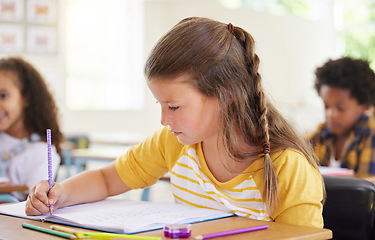 Image showing Education, drawing or girl child in classroom learning, exam or studying with preschool notebooks. Development, smart kids or serious student with creative art writing for knowledge in kindergarten