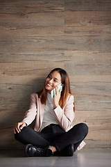 Image showing Young business woman, floor and phone call with smile for networking, discussion and talk in modern office. Professional female, smartphone and listen for conversation, chat and space for mock up