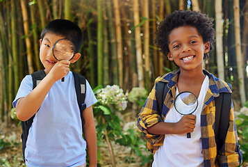 Image showing Nature, magnifying glass and portrait of curious children exploring in park for education in sustainability and science. Friends, garden investigation and discovery, kids in summer looking at plants.