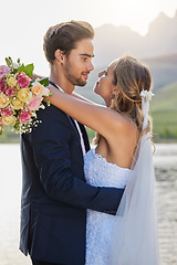 Image showing Love, lake wedding and couple hug for bond commitment, romantic ceremony or union event in outdoor nature. Eye contact, flower bouquet and marriage of man, woman or fiance together in solidarity