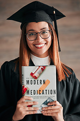 Image showing Doctor graduate, woman portrait and medical textbook of a young student happy from graduation. Learning book, happiness and excited female ready for university education with a smile from knowledge