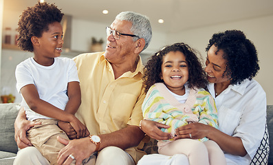 Image showing Family, love and grandparents with children on sofa in living room for playing, bonding and quality time. Love, home and happy grandfather, grandma and kids with smile, relaxing and laugh together