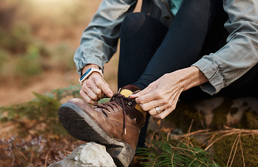 Image showing Closeup, hands and tie shoes for walking, hiking and workout for healthy lifestyle, wellness and cardio. Person, hiker and tying shoelace for fitness, training and travel for adventure and fresh air