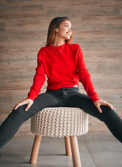 Image showing Happy, relax and a woman thinking on a chair with fashion, idea and vision in a living room. Smile, lifestyle and a girl sitting with stylish clothing, confidence and happiness in a home lounge