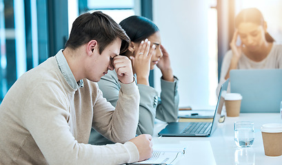 Image showing Tired, stress and business people in a meeting with a headache, problem and team depression. Sad, anxiety and corporate employees frustrated with burnout, fatigue and a coworking mistake at work