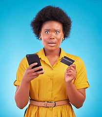 Image showing Black woman, phone and credit card with shock, portrait and wow face in studio by blue background. Surprise girl, african or smartphone on online shopping app, e commerce store or amazed for discount