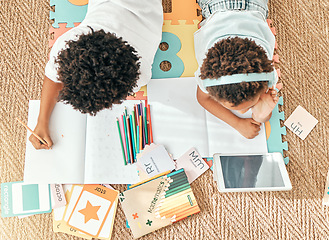 Image showing Kids, home education an online knowledge app with children doing elearning and writing activity. Kid video streaming, school student note book and above of a child and sibling together on the ground