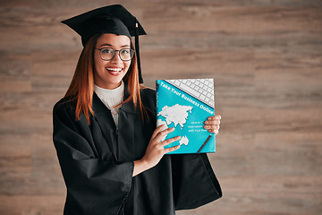 Image showing Graduate, woman portrait and business textbook of a young student happy from graduation. Learning book, happiness and excited female ready for university education with a smile from knowledge
