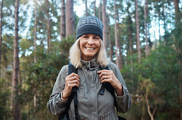 Image showing Happy, hiking and portrait of old woman in nature for relax, trekking and adventure. Travel, wellness and vacation with female walking in forest for retirement, backpacking and cardio endurance