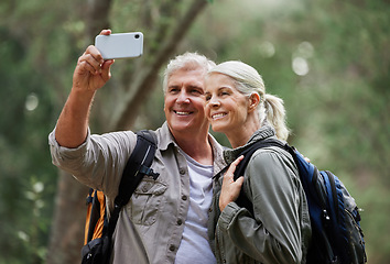 Image showing Selfie, hiking and happy mature couple of friends in forest adventure, journey and outdoor health with happy blog update. Nature, travel and trekking people in woods together and profile picture post