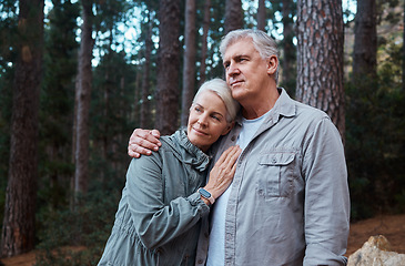 Image showing Hug, hike and senior couple outdoor, fitness and bonding in nature, quality time and happiness outside. Wellness, mature man and old woman in forest, exercise and fresh air for healthy lifestyle