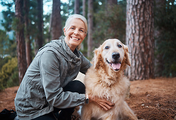 Image showing Elderly woman, portrait and hiking with dog in forest and fitness, travel and pet with love and care. Nature, trekking and vitality, mature female in retirement and golden retriever puppy outdoor