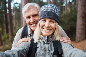 Image showing Senior couple, selfie and portrait, hiking in forest and happy people in nature and memory for social media post. Smile in picture, adventure and fitness outdoor, man and woman with active lifestyle