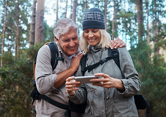 Image showing Phone, hiking and happy senior people in nature with network, social media or video streaming in forest. Mature couple of friends trekking or travel in woods with funny meme, smartphone or mobile app