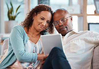 Image showing Mature couple, tablet and sofa in home living room for bonding, love and video on app for memory. Black man, woman and mobile touchscreen to watch movie on internet in house on lounge couch to relax