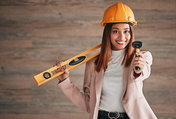 Image showing Architect, business woman and portrait of a property management worker with construction tools. Safety helmet, smile and stud detector for a home renovation project with a happy female employee