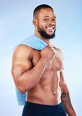 Image showing Black man, portrait and body towel with a smile in studio for health, wellness and fitness. Face of healthy male aesthetic model with clean skin, strong muscle and happiness on a blue background