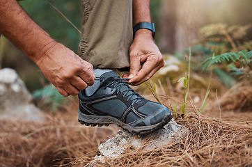 Image showing Closeup, hands and tie shoes on hike, start walk and fitness for wellness, workout and exercise. Male, hiker and guy tying shoelace, prepare for hiking and training for cardio and healthy lifestyle