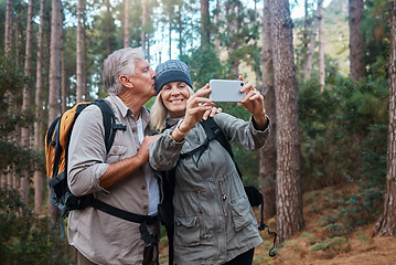 Image showing Elderly, couple take selfie and hiking in forest, happy people in nature and memory for social media post. Smile in picture, adventure and fitness, old man and woman are outdoor with active lifestyle