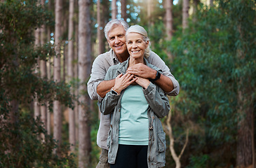 Image showing Forest, portrait and senior couple hug for love, retirement wellness and health in nature hiking or travel. Face of happy mature woman and partner or people together in woods, park or countryside