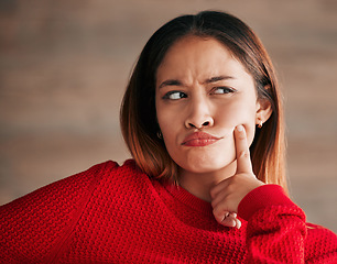 Image showing Thinking, woman and wondering face closeup of a young female with decision and choice. Planning, solution and contemplation of a person with focus and creative strategy idea feeling thoughtful