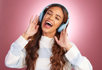 Image showing Mockup, sing and woman with headphones, streaming music and happiness against pink studio background. Female, happy lady and headset for sounds, listening to radio or audio for wellness or motivation