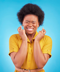 Image showing Black woman, fingers crossed and hope in studio, blue background and hopeful face. Female model, wish and hands in lucky bonus, promotion and winning giveaway competition, emoji sign or lottery prize