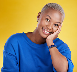 Image showing Black woman, face and smile portrait in studio for motivation, beauty and happiness. Young african female model on a yellow background happy about natural cosmetics, positive color and carefree mood