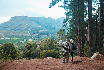 Image showing Mountains, view and hiking, old couple pointing at nature on walk in Peru for retirement holiday adventure. Travel, senior man and woman on mountain cliff, peaceful forest hike with love and health.